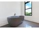 Beautiful bathroom with standalone tub and a large window providing ample natural light at 8200 Main S St # 1208, Woodstock, GA 30188