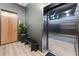 Hallway with bench, potted plant, and access to elevator at 8200 Main S St # 1208, Woodstock, GA 30188