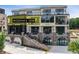 Attractive three-story condo building with outdoor terraces and street-level storefronts at 8200 Main S St # 1208, Woodstock, GA 30188