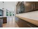 Open kitchen showcases sleek brown cabinetry, quartz countertops, and stainless steel appliances at 8200 Main S St # 1208, Woodstock, GA 30188