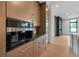 Modern kitchen features a Miele coffee maker, and custom cabinets at 8200 Main S St # 1208, Woodstock, GA 30188