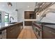 Modern kitchen with stainless steel appliances, a large island, and sleek countertops at 8200 Main S St # 1208, Woodstock, GA 30188