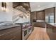 Beautiful kitchen with a large gas range, stainless steel appliances, and ample cabinet space at 8200 Main S St # 1208, Woodstock, GA 30188