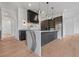 Modern kitchen featuring a waterfall island, professional-grade appliances at 8200 Main S St # 1208, Woodstock, GA 30188