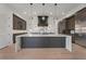 Spacious kitchen includes a central island and stainless steel refrigerator at 8200 Main S St # 1208, Woodstock, GA 30188