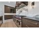 Chef's kitchen features stainless steel appliances, custom cabinetry and range at 8200 Main S St # 1208, Woodstock, GA 30188