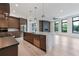 Bright open-concept kitchen with stainless steel appliances, a large island, and modern pendant lighting at 8200 Main S St # 1208, Woodstock, GA 30188