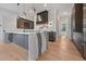 Kitchen featuring a waterfall island, stainless steel appliances at 8200 Main S St # 1208, Woodstock, GA 30188