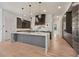 Gourmet kitchen boasts a waterfall island and stainless steel appliances at 8200 Main S St # 1208, Woodstock, GA 30188