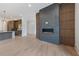 Open living room showcases a fireplace and kitchen at 8200 Main S St # 1208, Woodstock, GA 30188