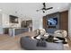 Open concept featuring a kitchen island, fireplace, sleek seating, and hardwood floors at 8200 Main S St # 1208, Woodstock, GA 30188