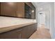 Spacious pantry with custom cabinetry, lots of storage and hardwood flooring at 8200 Main S St # 1208, Woodstock, GA 30188