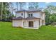 View of the backyard showing the home's exterior and well-maintained lawn at 2884 Thompson Cir, Decatur, GA 30034