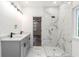 This bathroom offers a large walk-in shower with marble-style tile and modern fixtures at 2884 Thompson Cir, Decatur, GA 30034