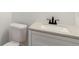 Modern half bath with a stylish vanity, sleek faucet, and a comfortable toilet at 2884 Thompson Cir, Decatur, GA 30034