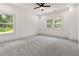 Spacious bedroom features soft gray carpet and plenty of natural light through multiple windows at 2884 Thompson Cir, Decatur, GA 30034