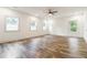Spacious bedroom with hardwood floors, ceiling fan, and abundant natural light at 2884 Thompson Cir, Decatur, GA 30034