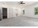 Neutral colored bedroom with natural lighting, a ceiling fan and en suite bathroom at 2884 Thompson Cir, Decatur, GA 30034