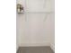 Empty walk-in closet with white wire shelving and gray carpet at 2884 Thompson Cir, Decatur, GA 30034