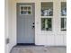 Charming home features a stylish gray front door with glass panels and sidelight windows for a welcoming entrance at 2884 Thompson Cir, Decatur, GA 30034