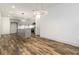 Modern kitchen with gray cabinets, stainless steel appliances, an island with sink, and wood flooring at 2884 Thompson Cir, Decatur, GA 30034