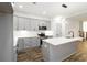 Modern kitchen with gray cabinets, stainless steel appliances, quartz countertops and wood flooring at 2884 Thompson Cir, Decatur, GA 30034