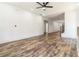 Spacious living room boasts wood floors, modern lighting, and an open floor plan leading to the staircase at 2884 Thompson Cir, Decatur, GA 30034
