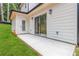 This home features a concrete patio and sliding glass doors to the backyard at 2884 Thompson Cir, Decatur, GA 30034