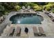 Aerial shot of an in-ground pool surrounded by lounge chairs and manicured landscaping at 3560 Ridgewood Nw Rd, Atlanta, GA 30327