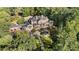 Stunning estate with a private pool surrounded by lush greenery and mature trees at 3560 Ridgewood Nw Rd, Atlanta, GA 30327
