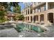 Inviting backyard pool with a spa, surrounded by lush landscaping and a spacious patio at 3560 Ridgewood Nw Rd, Atlanta, GA 30327