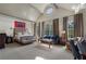 Large bedroom with vaulted ceilings, multiple windows, and comfortable furnishings at 3560 Ridgewood Nw Rd, Atlanta, GA 30327