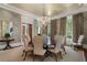 Elegant dining room with a round table and chandelier at 3560 Ridgewood Nw Rd, Atlanta, GA 30327