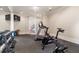 Well-equipped exercise room with a treadmill, stationary bike, free weights and a wall mounted tv at 3560 Ridgewood Nw Rd, Atlanta, GA 30327
