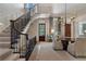 Elegant foyer with staircase, chandelier, and dining area at 3560 Ridgewood Nw Rd, Atlanta, GA 30327