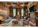 Wood-paneled office with a fireplace and custom built-ins at 3560 Ridgewood Nw Rd, Atlanta, GA 30327