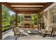 Covered patio with brick fireplace and comfortable seating, perfect for outdoor relaxation at 3560 Ridgewood Nw Rd, Atlanta, GA 30327