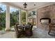 Charming outdoor patio with a built-in grill, stone flooring, and elegant columns at 3560 Ridgewood Nw Rd, Atlanta, GA 30327
