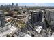 Aerial view showcases a cityscape with modern architecture, roads, and tree-lined streets under a bright sky at 3107 Peachtree Ne Rd # 1101, Atlanta, GA 30305