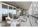 Inviting condo balcony with city views, comfortable seating, and an outdoor grill, perfect for relaxing or entertaining at 3107 Peachtree Ne Rd # 1101, Atlanta, GA 30305