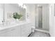 Modern bathroom featuring double sinks, glass shower, and elegant finishes with hardwood floors at 3324 Springhaven Ave, Atlanta, GA 30354