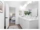 Modern bathroom featuring double sinks, elegant finishes, and easy access to the main bedroom at 3324 Springhaven Ave, Atlanta, GA 30354