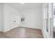 A bright bedroom with large windows and sleek, light hardwood flooring and ample natural light at 3324 Springhaven Ave, Atlanta, GA 30354
