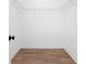 A walk-in closet with wood flooring and metal shelving offers ample storage space at 3324 Springhaven Ave, Atlanta, GA 30354