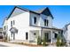 Charming two-story home featuring white siding, gray accents, and a welcoming front porch at 3324 Springhaven Ave, Atlanta, GA 30354