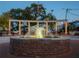Charming water fountain featuring a brick base and string lighting in an outdoor public space at 3324 Springhaven Ave, Atlanta, GA 30354