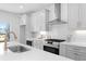 Modern kitchen with white cabinets, quartz countertops, and stainless steel appliances at 3324 Springhaven Ave, Atlanta, GA 30354