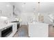 Bright kitchen featuring an island with stainless steel appliances and stylish pendant lights at 3324 Springhaven Ave, Atlanta, GA 30354