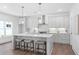 Bright kitchen with quartz countertops, stainless steel appliances, and stylish pendant lighting at 3324 Springhaven Ave, Atlanta, GA 30354