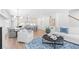 Open-concept living room with modern decor, wood floors, and abundant natural light at 3324 Springhaven Ave, Atlanta, GA 30354